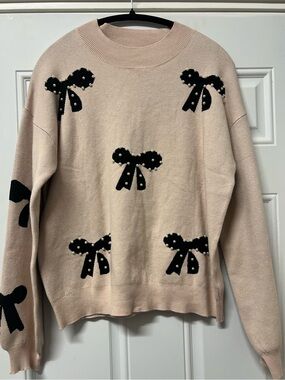 Artsel taupe sweater with black bow and pearl detail size large